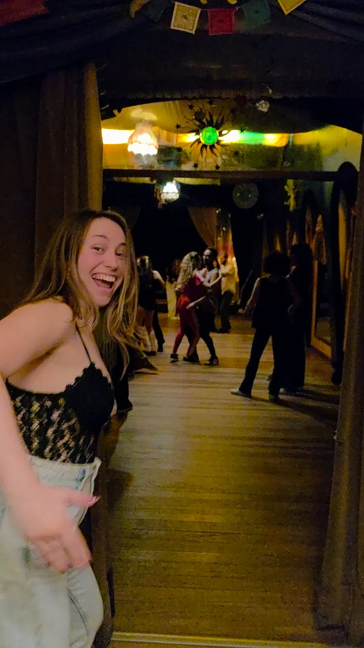 A smiling dancer at a Zouk social