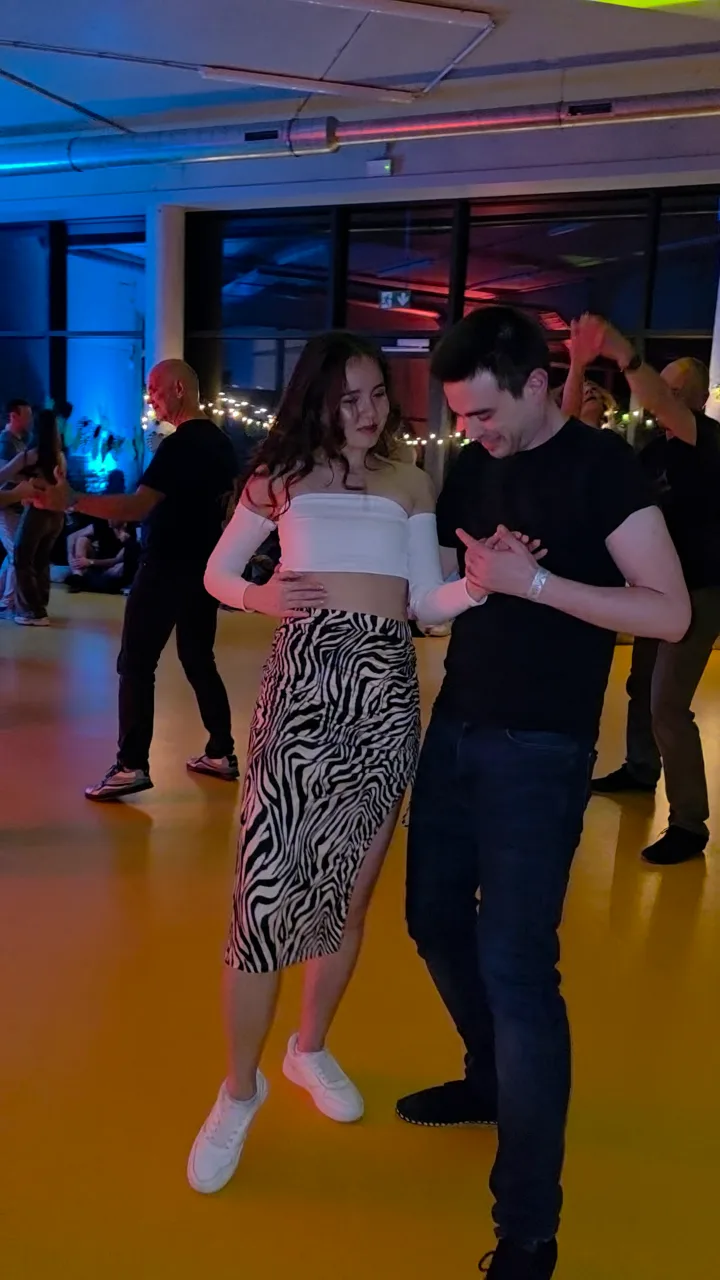 A couple dancing at an evening social