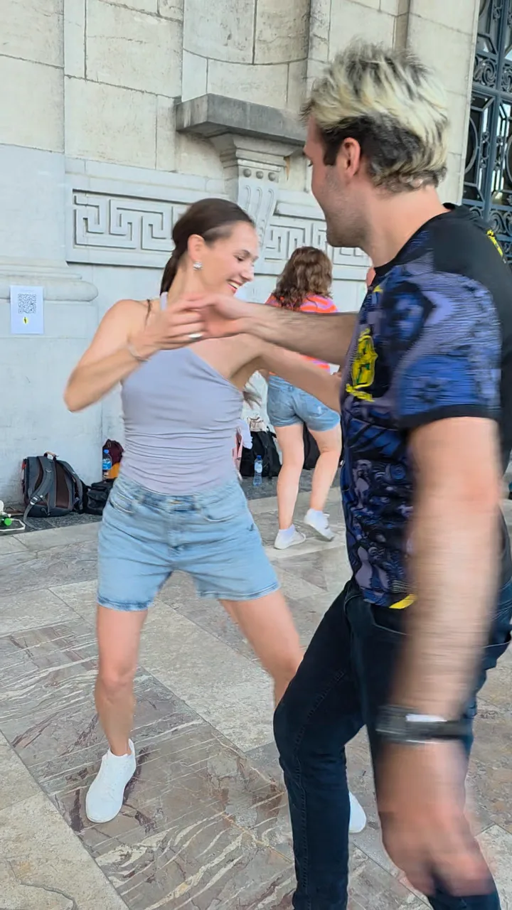 A couple dancing outdoors