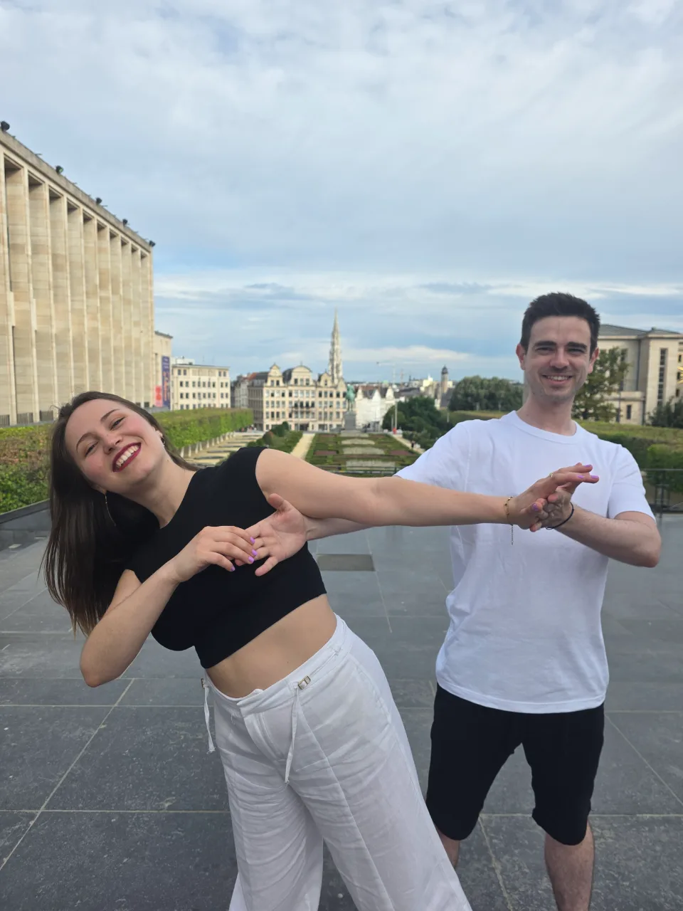 Two dancers striking a pose outdoors in Brussels