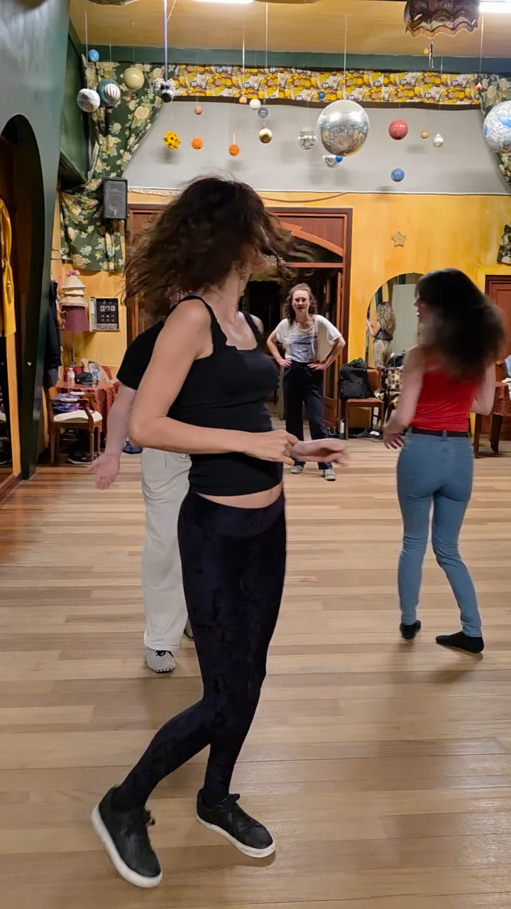 Dancers turning in a festive room